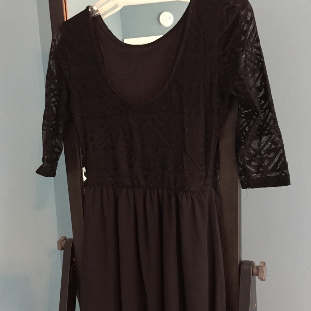 Quarter sleeve black sheer and lace dress.